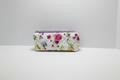 Handmade purple floral and dark gingham quilted makeup bag with purple ribbon detail and artisan KIALIYAH label.