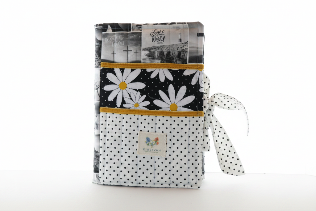 Handmade black and white floral quilted book sleeve, artisan book protector for hardcovers with monochrome botanical print.