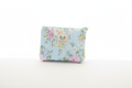 English Rose quilted canvas wallet pouch with a light blue and pink rose floral pattern, matching mint zipper closure, and a central fabric brand label against a clean white background.