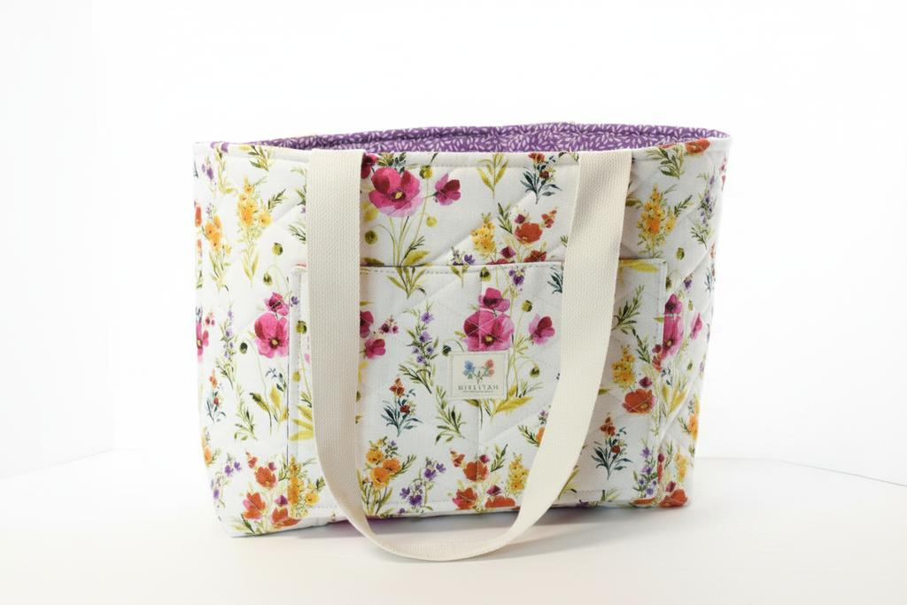 Floral-patterned tote bag with a white background
