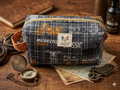 Highway Classic Quilted Makeup Bag boxy cosmetic case featuring a charcoal plaid vintage motorcycle print with an orange polka dot side handle next to a brass compass.