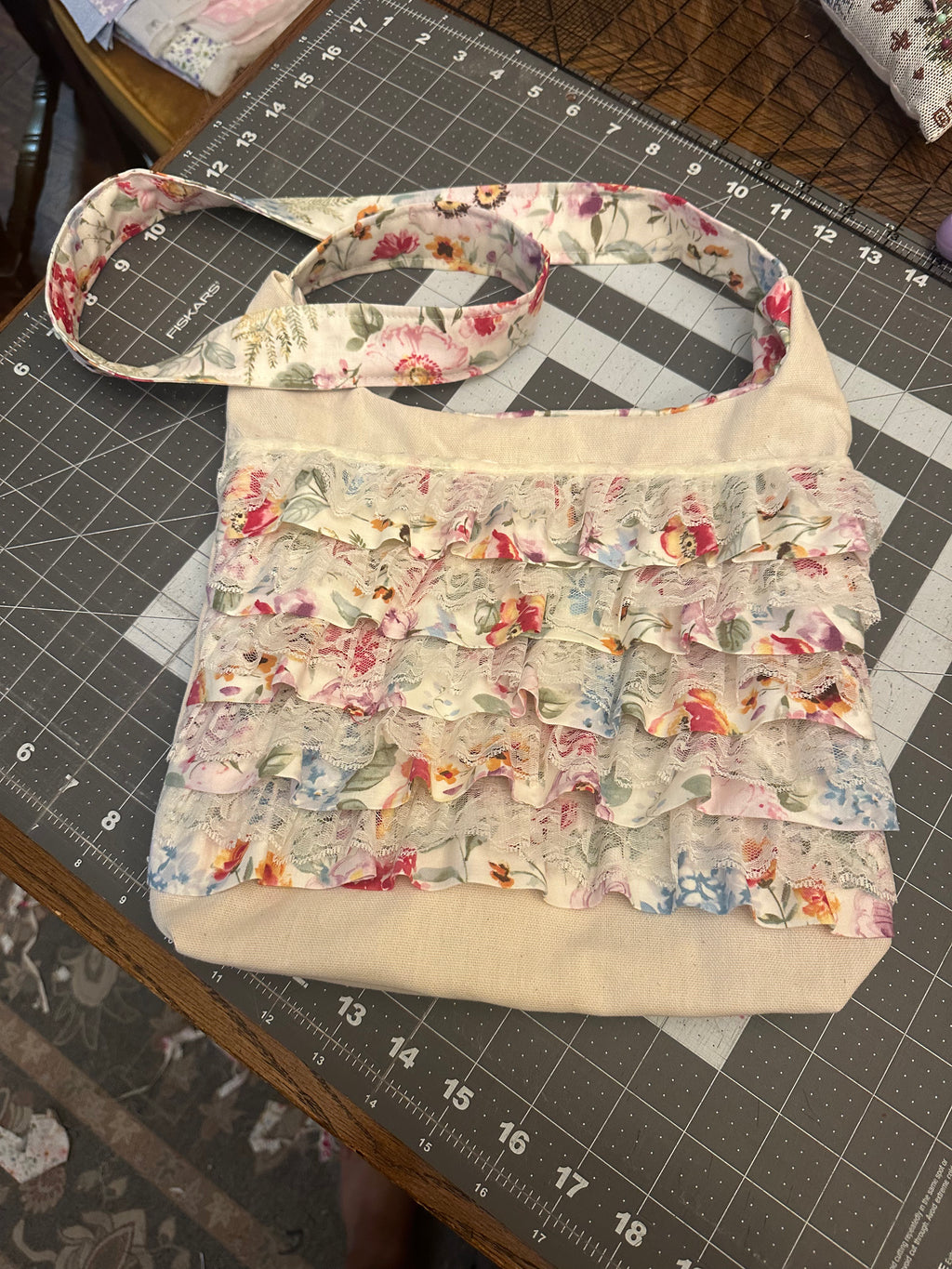 Floral patterned bag on a cutting mat with measurements