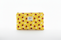 The Sunny Ladybug Quilted Pouch & Small Wallet featuring a botanical vine and ladybug top print, a yellow and white gingham check quilted base, a gold-tone top zipper with a matching fabric pull-tab, and a centered white KIALIYAH label.